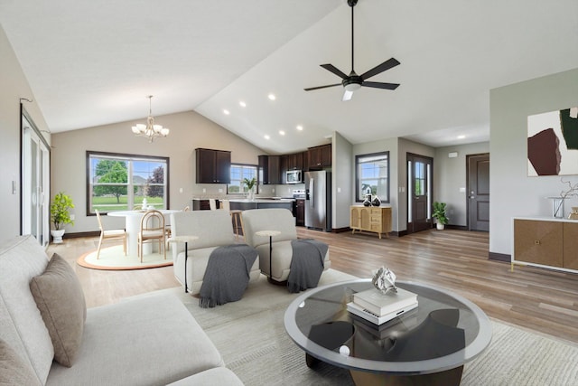 4050 Cayman Dr, Dewitt, MI 48820 - living area featuring light wood-style flooring, a chandelier, vaulted ceiling, recessed lighting, and baseboards