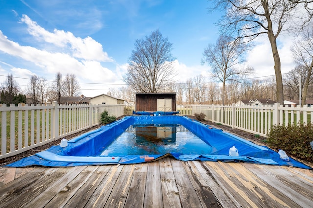 2266 Thunderbird Dr, Niles, MI 49120 - view of pool with an outbuilding, a fenced in pool, a fenced backyard, and a wooden deck