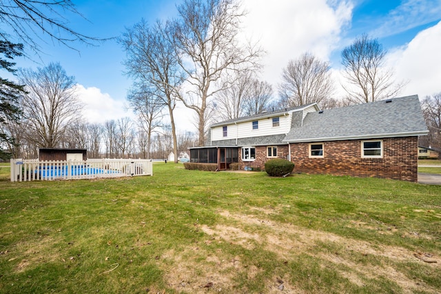 2266 Thunderbird Dr, Niles, MI 49120 - view of yard with a sunroom, fence, and a fenced in pool
