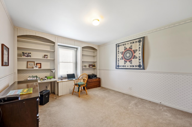 2266 Thunderbird Dr, Niles, MI 49120 - office area featuring light colored carpet, baseboards, wallpapered walls, a wainscoted wall, and built in features