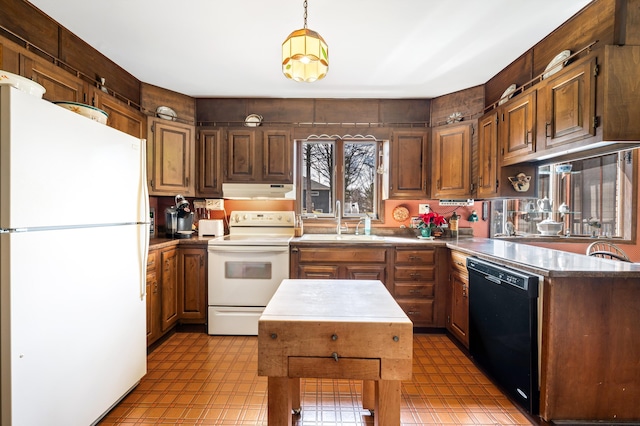 2266 Thunderbird Dr, Niles, MI 49120 - kitchen featuring light countertops, white appliances, under cabinet range hood, a sink, and light floors