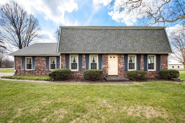 2266 Thunderbird Dr, Niles, MI 49120 - dutch colonial featuring brick siding, a front yard, and roof with shingles