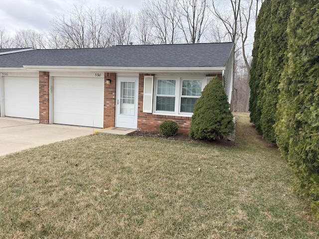 single story home featuring concrete driveway, a front yard, brick siding, a garage, and a shingled roof