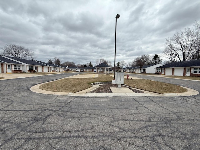view of road with street lights and a residential view