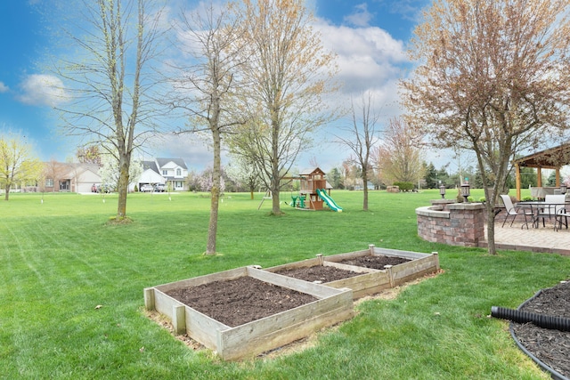 448 Marblewood Ln, Saline, MI 48176 - view of green lawn featuring a playground, a garden, a patio area, and a gazebo