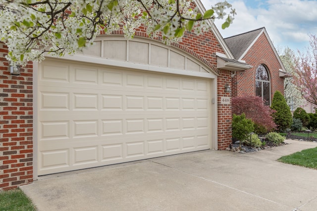 448 Marblewood Ln, Saline, MI 48176 - garage featuring concrete driveway