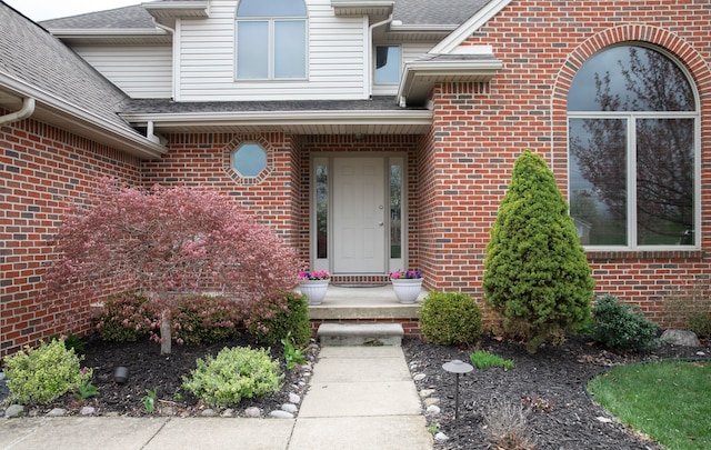 448 Marblewood Ln, Saline, MI 48176 - view of exterior entry with brick siding and roof with shingles
