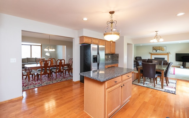 448 Marblewood Ln, Saline, MI 48176 - kitchen featuring stainless steel fridge, light wood finished floors, a chandelier, decorative light fixtures, and recessed lighting
