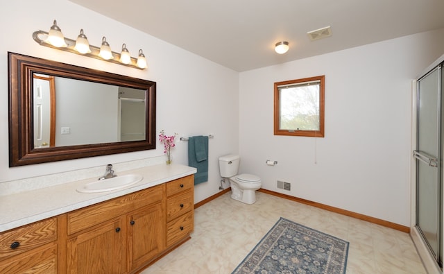 448 Marblewood Ln, Saline, MI 48176 - full bathroom featuring tile patterned floors, an enclosed shower, vanity, and toilet