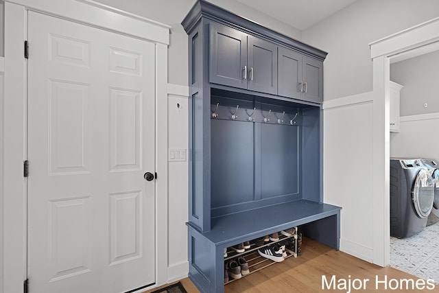 mudroom featuring washing machine and dryer and wood finished floors