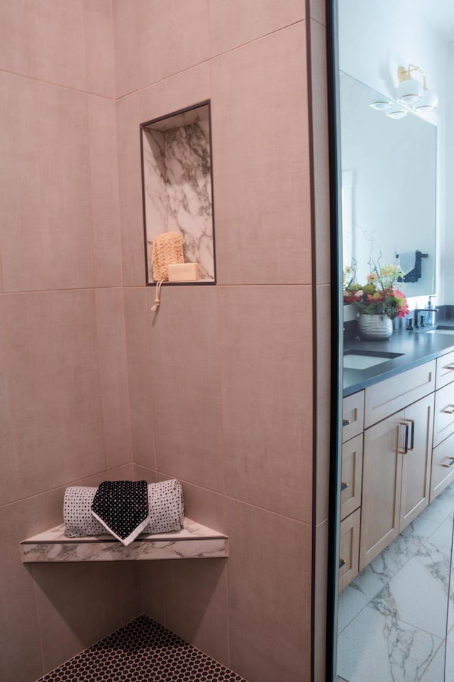 8120 Byron Depot Dr SW, Byron Center, MI 49315 - bathroom featuring marble look tile flooring and vanity