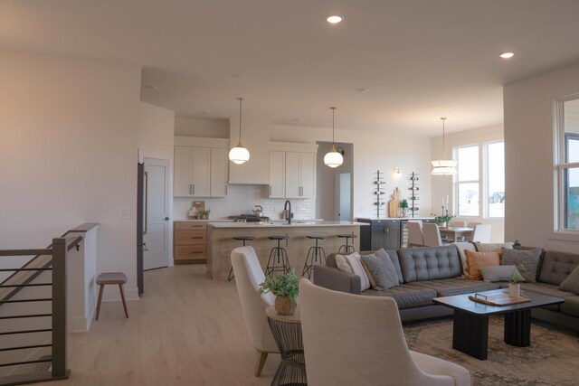 8120 Byron Depot Dr SW, Byron Center, MI 49315 - living room featuring light wood-type flooring and recessed lighting