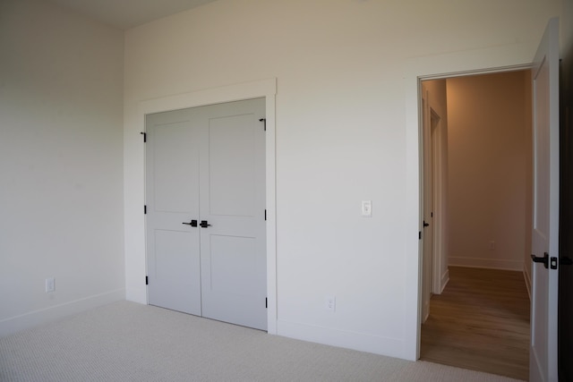8120 Byron Depot Dr SW, Byron Center, MI 49315 - unfurnished bedroom featuring carpet flooring and a closet