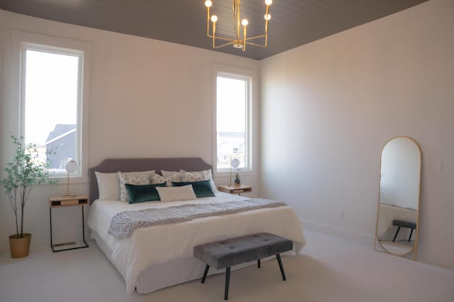 8120 Byron Depot Dr SW, Byron Center, MI 49315 - bedroom with a chandelier and carpet floors