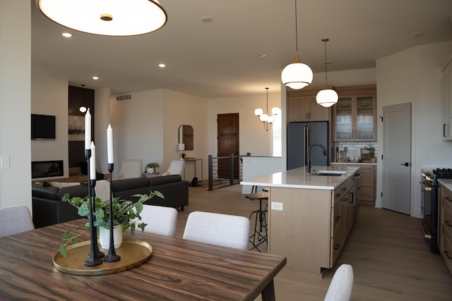 8120 Byron Depot Dr SW, Byron Center, MI 49315 - dining space featuring light wood-type flooring, a chandelier, and recessed lighting