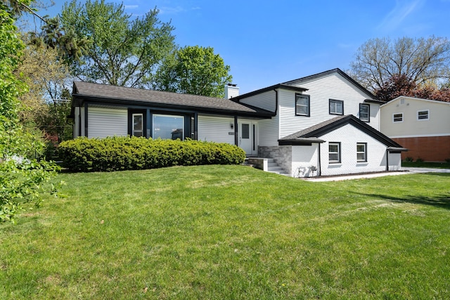 30728 W 14 Mile Rd, West Bloomfield, MI 48322 - tri-level home with a chimney and a front lawn