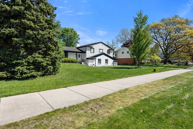 30728 W 14 Mile Rd, West Bloomfield, MI 48322 - view of front of property featuring a front lawn and a chimney
