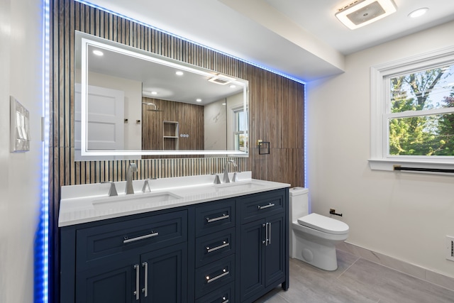 30728 W 14 Mile Rd, West Bloomfield, MI 48322 - bathroom featuring toilet, double vanity, recessed lighting, tile patterned floors, and baseboards