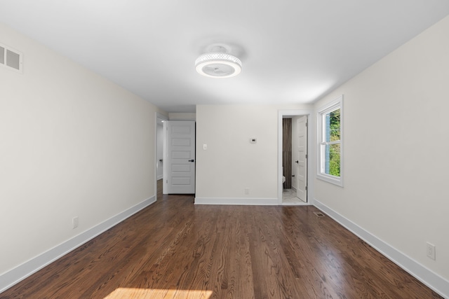 30728 W 14 Mile Rd, West Bloomfield, MI 48322 - spare room featuring baseboards and dark wood-style floors