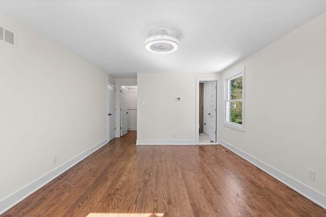 30728 W 14 Mile Rd, West Bloomfield, MI 48322 - spare room featuring baseboards and wood finished floors