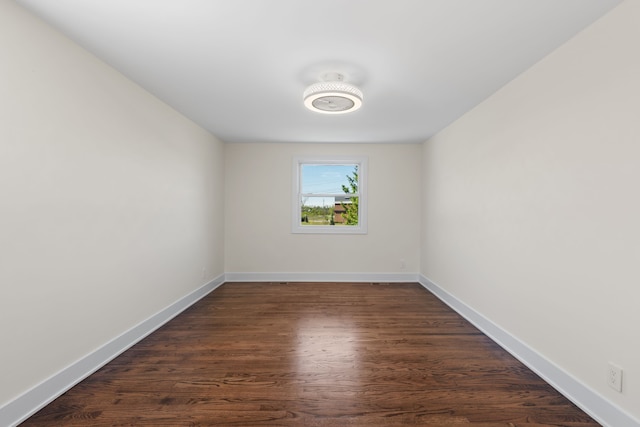 30728 W 14 Mile Rd, West Bloomfield, MI 48322 - empty room with dark wood-style floors and baseboards