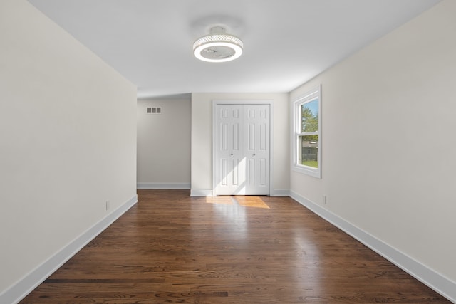 30728 W 14 Mile Rd, West Bloomfield, MI 48322 - unfurnished bedroom featuring baseboards, a closet, and dark wood-style floors
