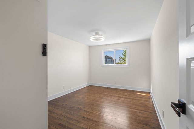 30728 W 14 Mile Rd, West Bloomfield, MI 48322 - empty room featuring wood finished floors and baseboards
