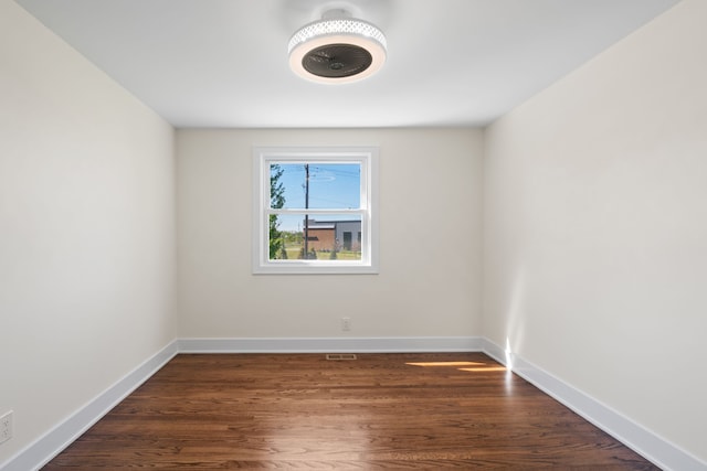 30728 W 14 Mile Rd, West Bloomfield, MI 48322 - unfurnished room with baseboards and dark wood-type flooring