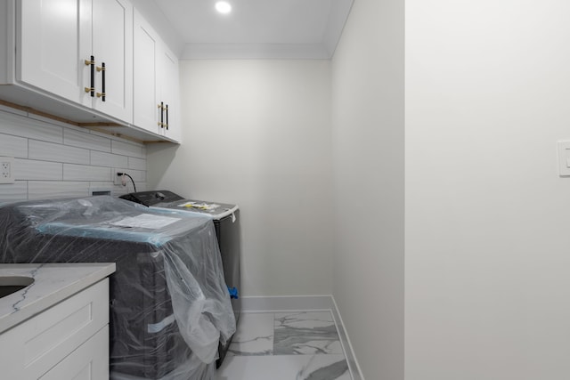 30728 W 14 Mile Rd, West Bloomfield, MI 48322 - laundry area featuring baseboards, washer / clothes dryer, cabinet space, and marble finish flooring