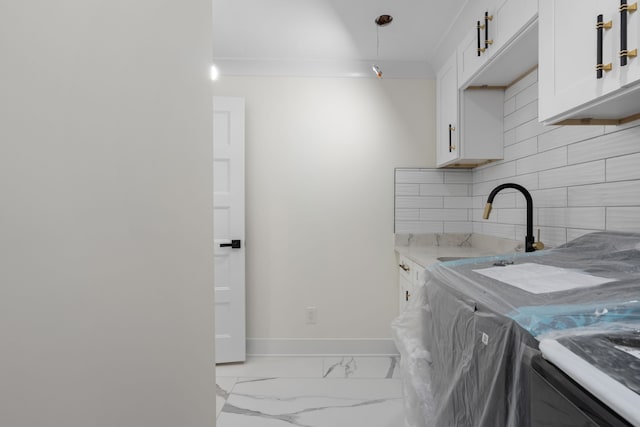 30728 W 14 Mile Rd, West Bloomfield, MI 48322 - clothes washing area with marble finish floors, baseboards, and a sink