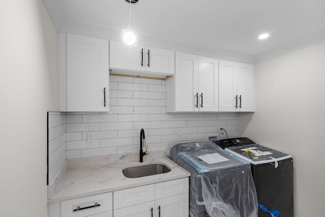 30728 W 14 Mile Rd, West Bloomfield, MI 48322 - clothes washing area with cabinet space and washing machine and dryer