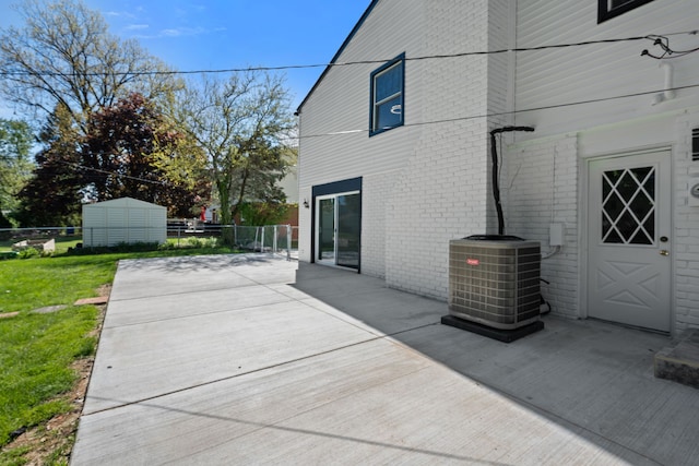30728 W 14 Mile Rd, West Bloomfield, MI 48322 - back of house with cooling unit, a patio, and brick siding