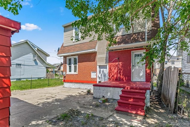 2947 Glynn, Detroit, MI 48206 - back of house with fence and brick siding