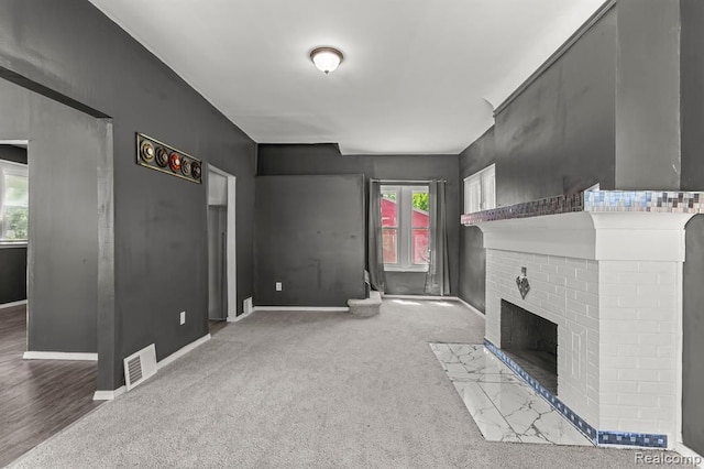 2947 Glynn, Detroit, MI 48206 - unfurnished living room with baseboards, visible vents, carpet floors, and a fireplace