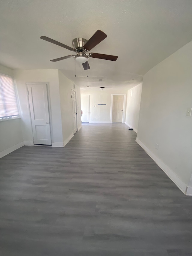 4543 Harriet St, Inkster, MI 48141 - interior space featuring dark wood-style flooring, baseboards, and a ceiling fan