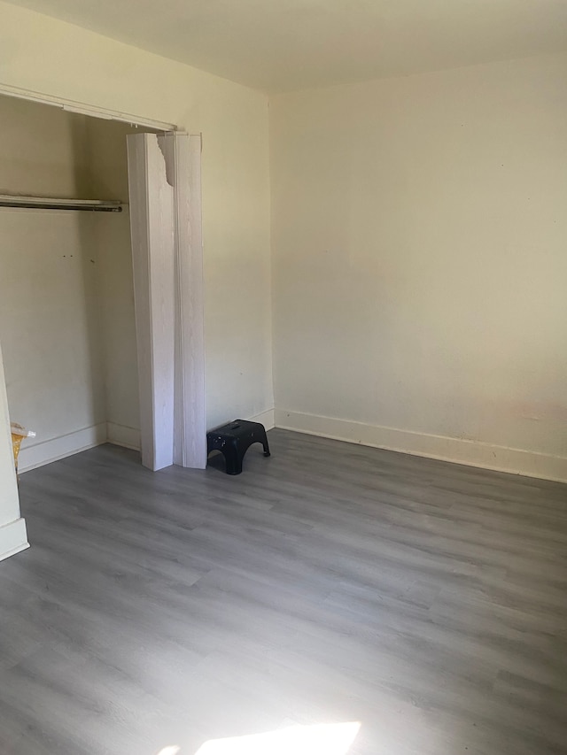 4543 Harriet St, Inkster, MI 48141 - unfurnished bedroom featuring a closet, baseboards, and wood finished floors
