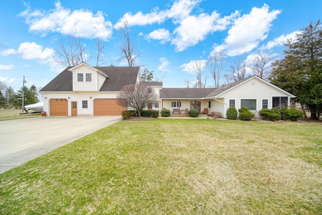 14073 Walz Blvd, Brooklyn, MI 49230 - view of front of house with a front lawn, driveway, a porch, and an attached garage