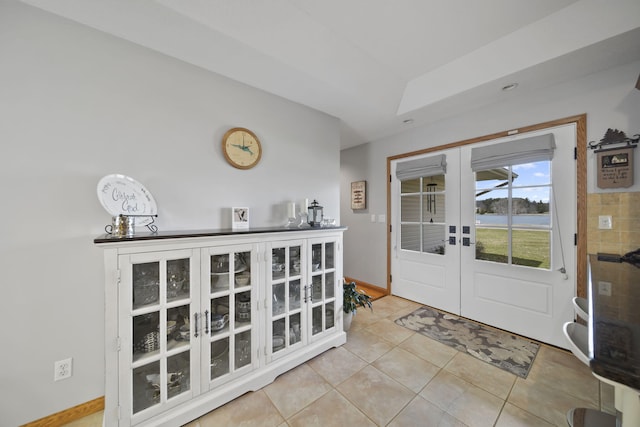 14073 Walz Blvd, Brooklyn, MI 49230 - foyer entrance with baseboards, french doors, and light tile patterned floors