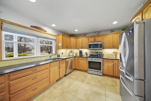14073 Walz Blvd, Brooklyn, MI 49230 - kitchen featuring decorative backsplash, light tile patterned flooring, recessed lighting, appliances with stainless steel finishes, and a sink