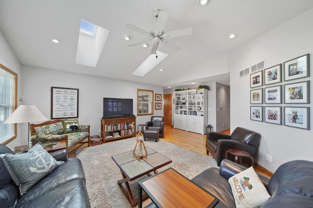 14073 Walz Blvd, Brooklyn, MI 49230 - living room with visible vents, wood finished floors, vaulted ceiling with skylight, recessed lighting, and a ceiling fan