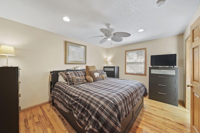 14073 Walz Blvd, Brooklyn, MI 49230 - bedroom with a ceiling fan, light wood finished floors, a textured ceiling, baseboards, and recessed lighting