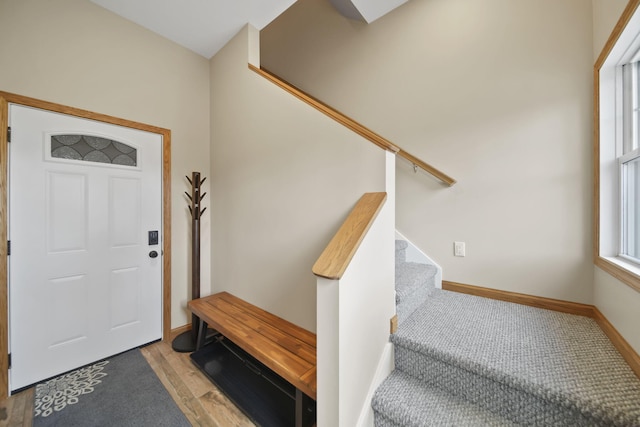 14073 Walz Blvd, Brooklyn, MI 49230 - entryway featuring stairs, wood finished floors, and baseboards