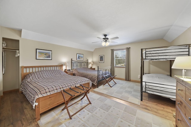 14073 Walz Blvd, Brooklyn, MI 49230 - bedroom featuring baseboards, vaulted ceiling, and light wood-type flooring