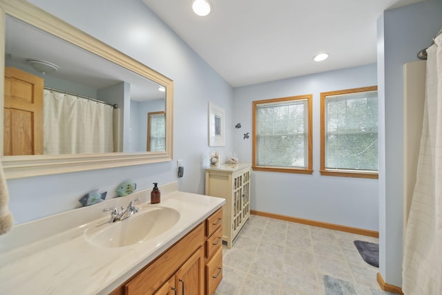 14073 Walz Blvd, Brooklyn, MI 49230 - bathroom featuring vanity, baseboards, and recessed lighting