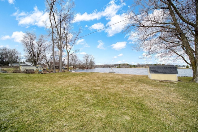 14073 Walz Blvd, Brooklyn, MI 49230 - view of yard featuring an outdoor structure, a water view, and a shed