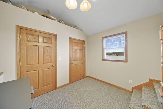 14073 Walz Blvd, Brooklyn, MI 49230 - carpeted bedroom featuring baseboards and vaulted ceiling