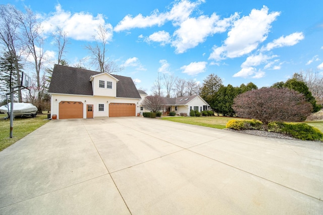 14073 Walz Blvd, Brooklyn, MI 49230 - view of home's exterior with concrete driveway, a garage, and a yard