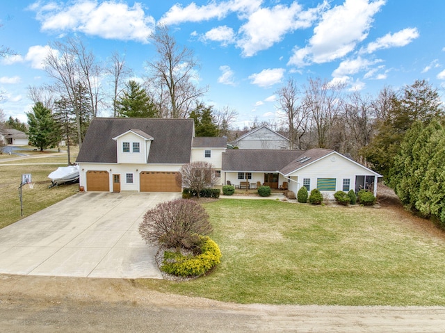 14073 Walz Blvd, Brooklyn, MI 49230 - view of front of house with covered porch, a front yard, concrete driveway, and a garage
