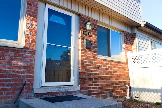 24951 Mayfair St Unit 20, Flat Rock, MI 48134 - property entrance featuring brick siding and fence