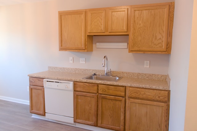 24951 Mayfair St Unit 20, Flat Rock, MI 48134 - kitchen featuring dishwasher, light countertops, a sink, and baseboards